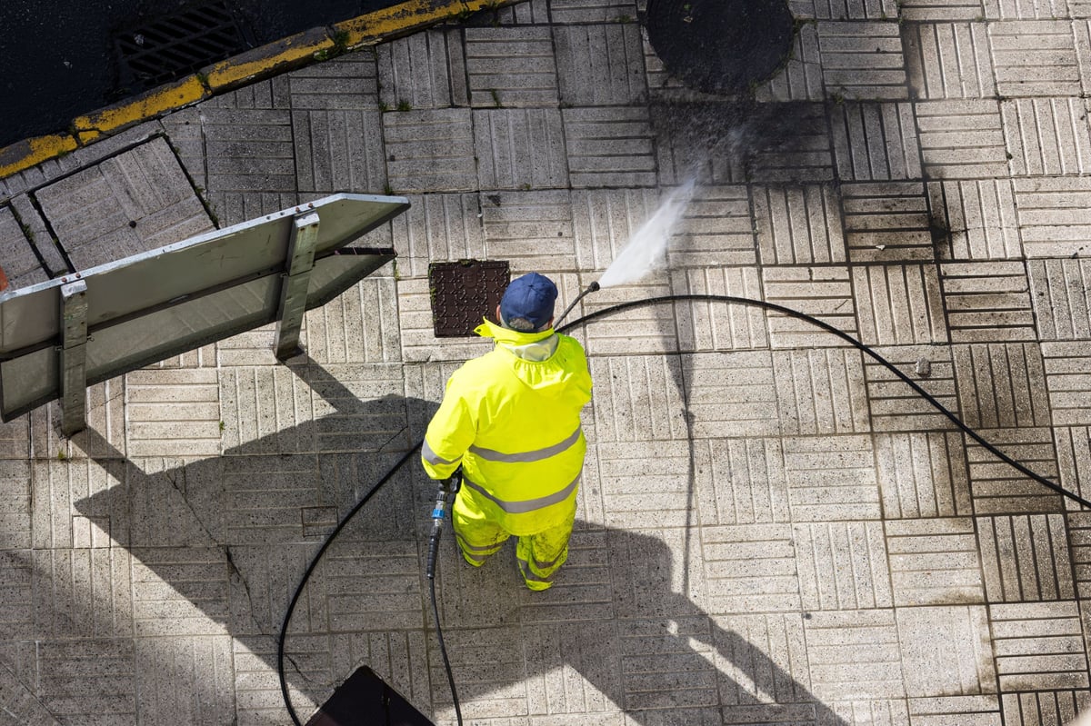 Sidewalk being pressure washed