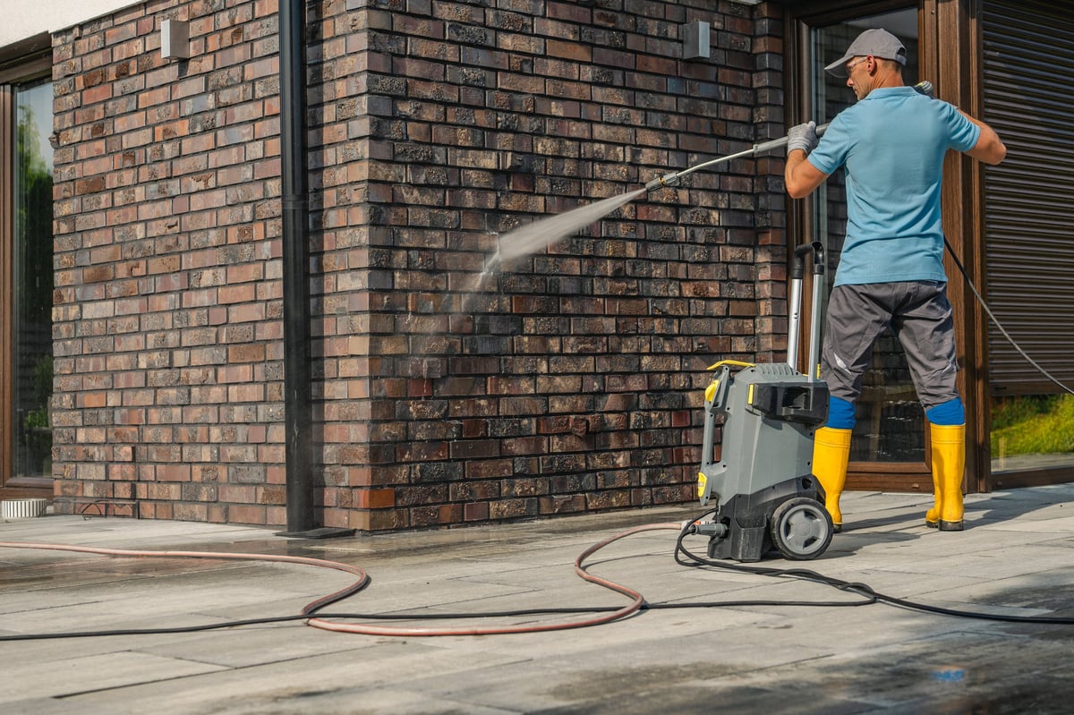 Brick wall being pressure washed